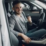Car rental excess insurance: driver holding the keys to a hire car