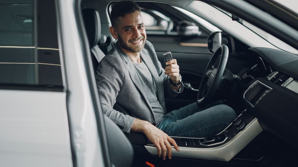 Car rental excess insurance: driver holding the keys to a hire car