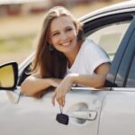 Car rental at Heathrow Airport: traveller collecting a hire car with the keys