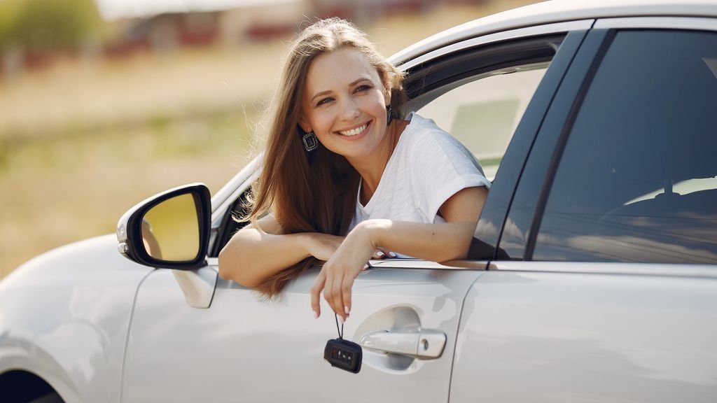 Car rental at Heathrow Airport: traveller collecting a hire car with the keys